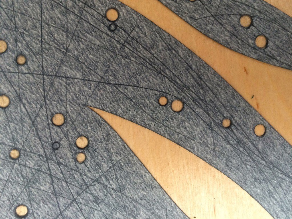 Six by Six by Eleven: birch plywood printing plate with stuck glass paper shapes (close up)